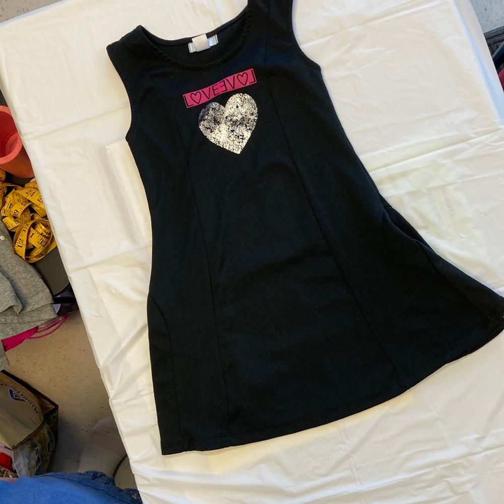 Girls black gymnastics outfit.